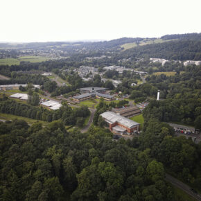 Drone image taken from above of the Symbiosis biologics manufacturing facility in Stirling, Scotland with surrounding woodland